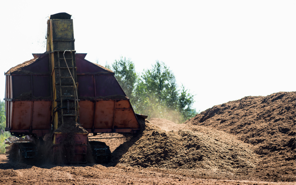 Peat extraction machinery working to extract peat from peatlands